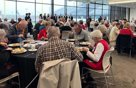 At the Childrens Health Stadium, senior citizens and students gather for the Senior Citizen Luncheon. The luncheon occured Wednesday, Dec. 8. Culinary students hosted the event.