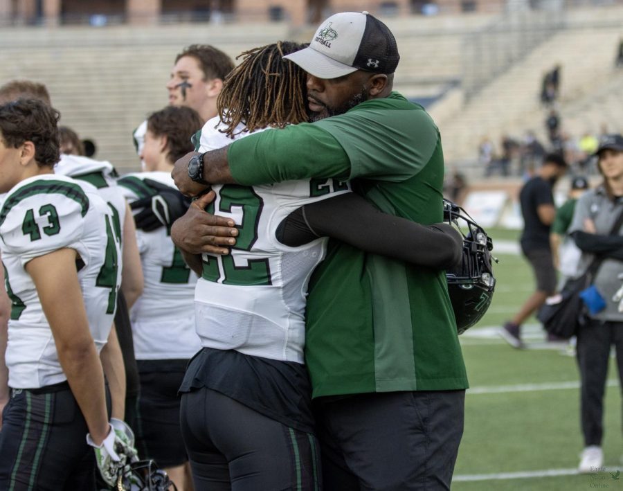 After playing against the Denton Guyer Wildcats, junior Kaiden Booker hugs coach Devin Lemons. Lemons coaches defensive line. The Eagles final record stands at 9-5. 