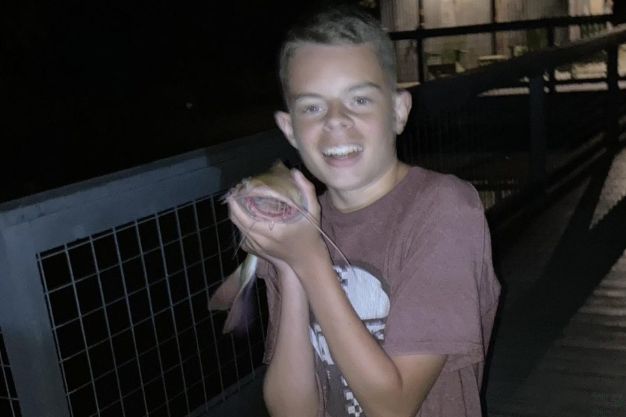 Catfish in hand, freshman Dylan Stetzko shows off his latest catch. Stetzko began fishing frequently during the widespread COVID-19 pandemic quarantine in 2020. “I love the sheer thrill of fishing, Stetzko said. Everyone always tells me, ‘Hey it’s boring. And, it can be. But, to me, it’s just a thrill.
