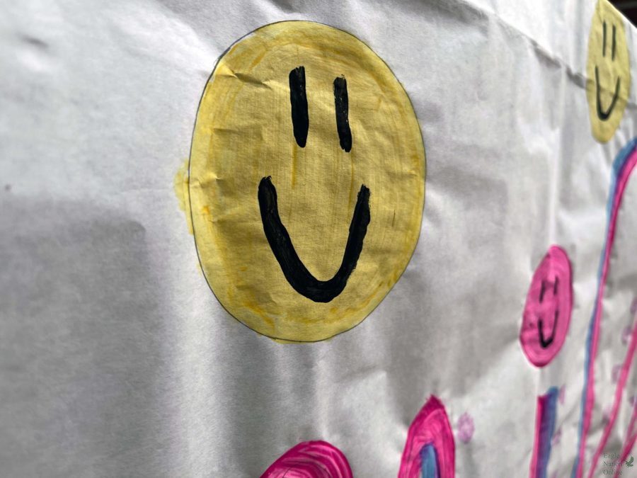 In the hallway, a poster by Hope Squad features happy faces and the word smile. Hope Week will occur Feb. 7-11. There will be dress up days that havent been announced yet.