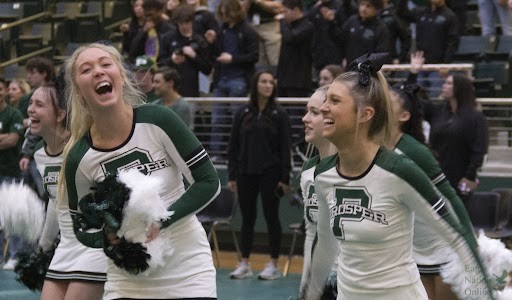 At the spring Meet the Eagles, seniors Kindall Drew and Meri Kate Edmundson laugh. Both students competed at a state competition Friday, Jan. 14. Spring Meet the Eagles highlighted spring sports, such as basketball, soccer, golf, wrestling and others.