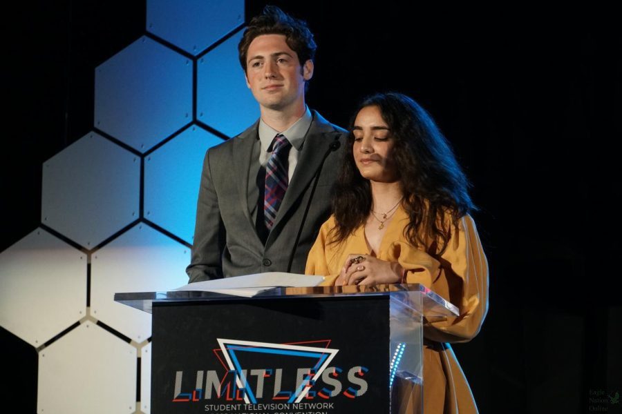 Standing next to Yalda Shams, senior Nolan Walley speaks at the STN closing ceremony. Shams attends Carlsbad High School in Carlsbad, California. Walley was one of 16 students from around the nation selected to speak at the ceremony.