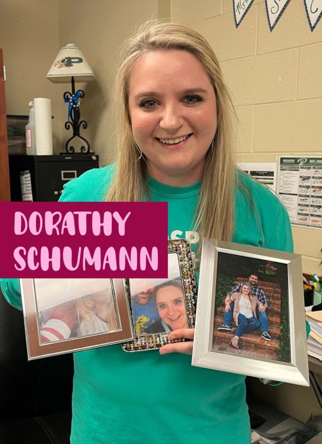 In her classroom, math teacher Dorathy Schumann holds up photos of her and her husband, Kyle.  Theyve been married for five years. Mrs. Schumann teaches Statistics and Honors Geometry. 