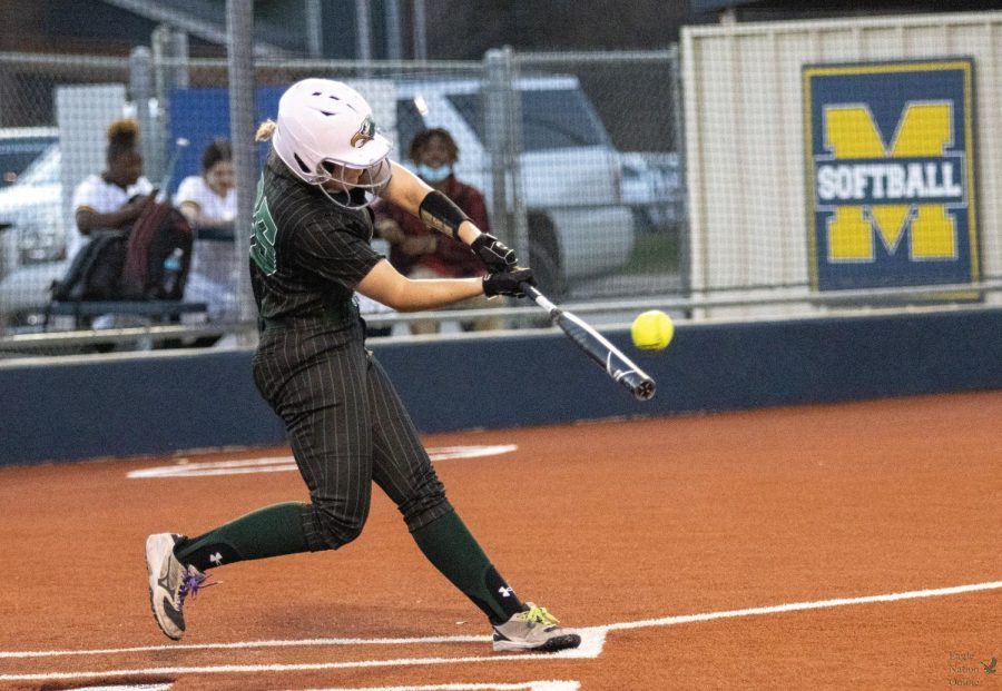 Swinging the bat, sophomore Angela Hamilton hits the ball. The Lady Eagles faced off against the McKinney High School Lionettes, Tuesday, March 15 at McKinney. Prosper won with a final score of 10-0.