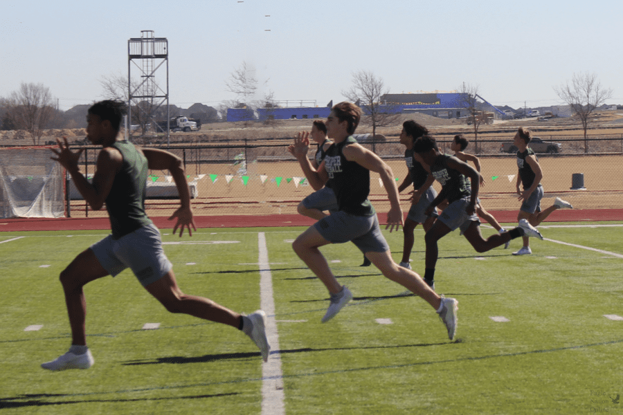 Preparing+for+the+upcoming+track+meet%2C+sprinters+warm+up+on+the+football+field.+The+next+track+meet+will+take+place+at+Lovejoy+High+School+on+Friday%2C+April+1.+Prosper+track+is+currently+ranked+No.+1+in+the+nation.