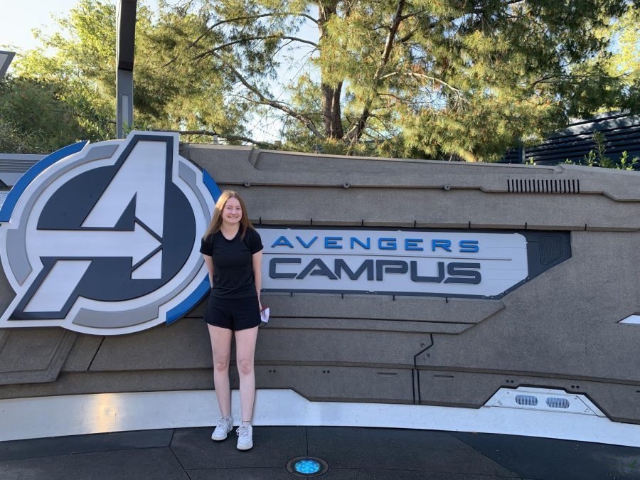 In Disneys California Adventure Park, senior Amanda Hare stands in front of the Avengers Campus sign. Avengers Campus opened in June of 2021. It features the Web-Slingers attraction and the Guardians of the Galaxy ride.
