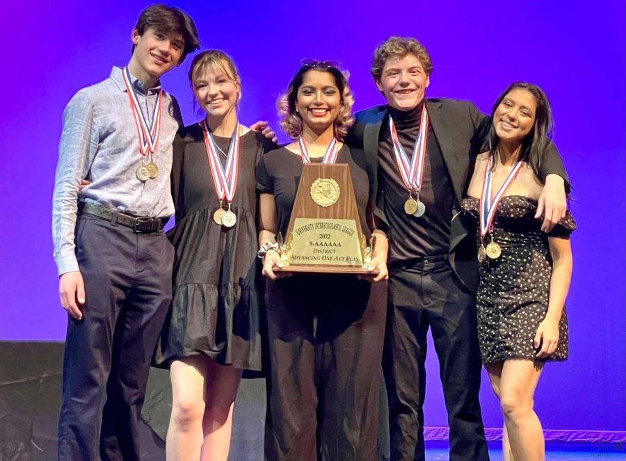 On the stage, Pierce Polomsky, Lauren Grammer, Cooper Smith, Karolina Rubio-Terrazas and Charlie Yohannan hold up a trophy. Theatre competed in the district competition and advanced to the bi-district compoetition. They performed The Crucible.