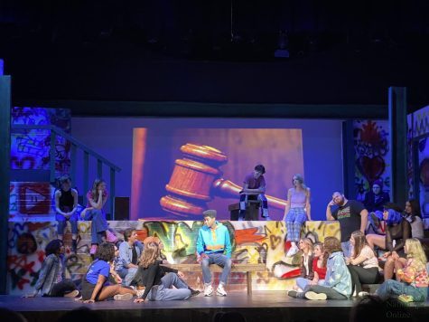 Sitting center stage, junior Dylan Korash, who plays Jesus, starts to tell a story from the Bible. Theatre is performing their play, Godspell Friday, April 8 and Satuday, April 9 at 6:30 p.m.. Its a retelling of the Gospel of Matthew in a modern setting. 