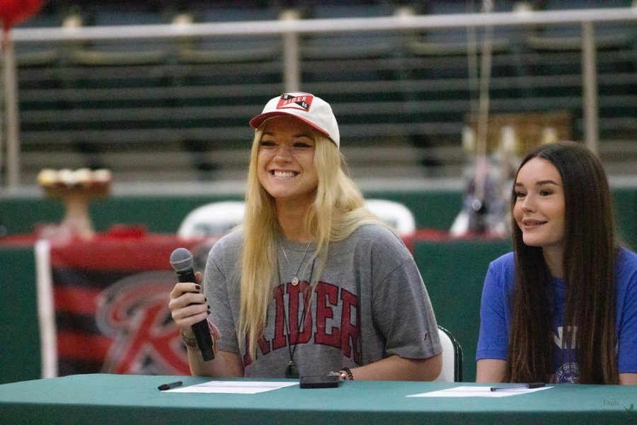 Senior+Kendall+Hewitt+looks+out+at+the+crowd.+She+plays+outside+hitter+for+the+varsity+softball+team.+She+signed+with+Rider+University.