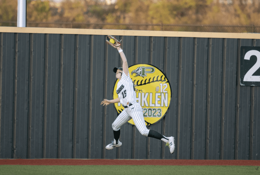 Jumping in the air, sophomore Elizabeth Bobbitt catches the ball. Bobbitt plays as a centerfielder. She also plays basketball for Prosper, as well as club softball for Texas Glory.