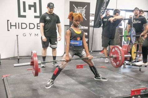 Training at the gym, senior Ryan Buckner engages in a deadlift. Ryan said this one represents her favorite type. She has goals to lift 320 pounds by the summer, along with setting a world record.