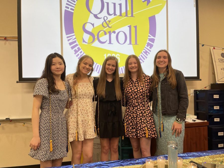 At the Quill & Scroll induction ceremony, Eagle Nation Online Editorial Board members senior Julia Chung, Alyssa Clark, Gabby Winans, Amanda Hare, and Christi Norris looks at the camera. Chung has been part of Eagle Nation Online for two years. She is the Executive Design Editor. 