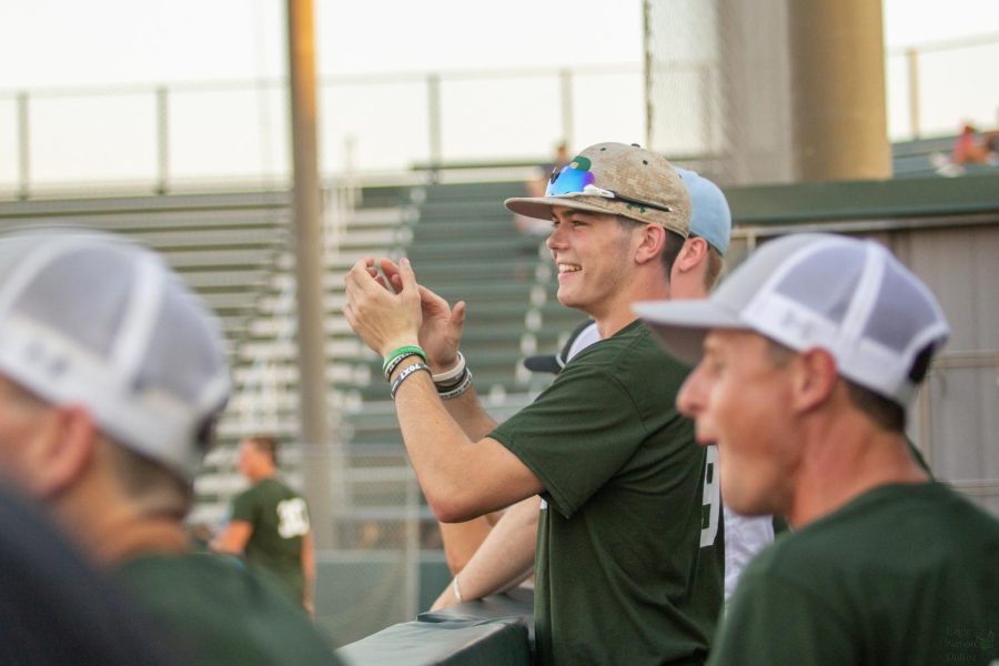 As hands clap in celebration for the teams third home run of the night, sophomore Caden Clay cheers from the dugout. Alongside Mason Belle-Isle, Clay helped put together Saturdays event that featured Prosper High coaches and athletes vs. Rock Hills.  Donations and funds collected at the game will go to benefit the Prosper Education Foundation.