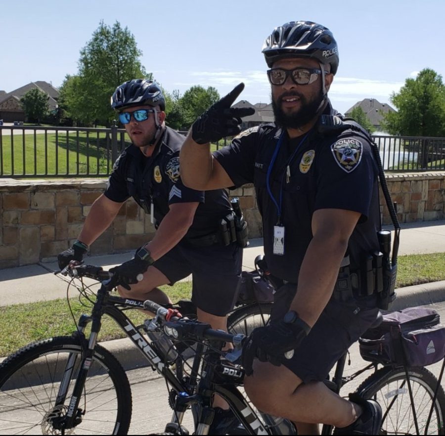 In uniform, Sergeant Chris Reeves and Officer George White ride bikes. They both have a passion for working out and staying in shape, teacher Laura Reeves said. They are both on the Prosper ISD Police Department Bike Unit, which has five officers currently.