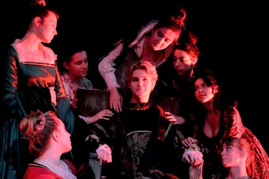 Surrounded by his queens including alumna Jessie Kuhn, seniors Lauren Grammer, Mikayla Sexton, and Marissa Denman, juniors Anna Stringer, and Riley Quinonez, and sophomore Mary Freitas, senior Tate Lauby portrays dream King Henry VIII while sitting in the shows lone set piece, a throne. The theatre department traveled to Scotland and England this summer for the International Fringe Theater Festival with the American High School Theater Festival. We had to go for a more minimalist design with the set because transporting a large set is not realistic, senior Lauren Grammer said. We had a couple props and other things that were put into peoples carry ons. I would say that was a (from other shows).
