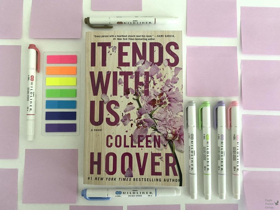The+book+It+Ends+With+Us%2C+by+Colleen+Hoover%2C+sits+amidst+pens+and+sticky+tabs.+These+tools+represent+ways+to+annotate+a+book+in+your+own+style.+I+never+liked+writing+in+my+books+until+I+learned+all+the+ways+to+annotate%2C+senior+Maya+Contreras+said.+Everything+is+a+lot+easier+to+remember.
