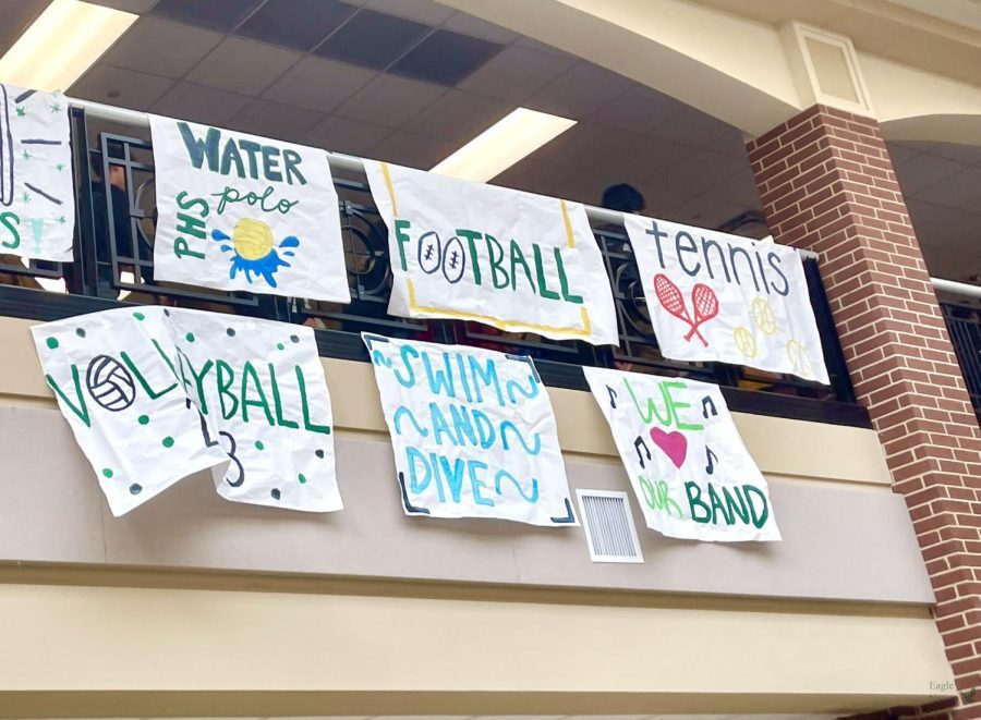 Posters+supporting+different+sports+teams+decorate+the+upper+level+of+Prosper+High+School.+The+first+row+of+posters+reads+PHS+water+polo%2C+football+and+tennis%2C+and+the+lower+row+reads+volleyball%2C+swim+and+dive%2C+and+we+heart+our+band.+Ninth+A+Volleyball%2C+and+JV+Volleyball+will+play+against+Allen+Sept.+27+at+5%3A30+p.m.+Students+can+learn+more+about+these+events+and+others+in+the+attached+Eagle+Brief+article.
