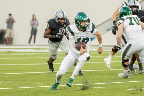 As he looks downfield, senior quarterback Harrison Rosar runs with the ball. The Eagles lost 6-23 to the Guyer Wildcats Friday, Sept. 16. The Eagles will play the Rock Hill Blue Hawks Friday, Sept. 23 at 7 p.m. at Childrens Health Stadium.