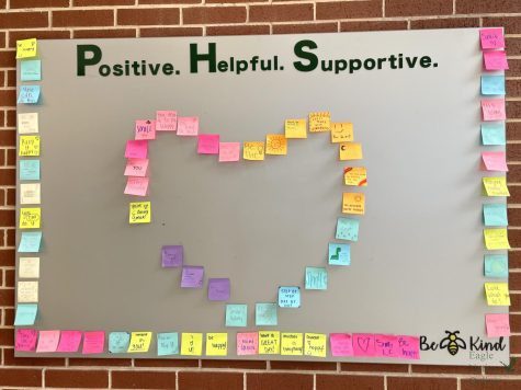 A board posted in the hallway of PHS is covered in colorful sticky notes in the shape of a heart. Positive messages are written on each sticky note. The week of Sep. 5 — 9 was suicide prevention week, and spirit days such as pajama day were designed to create awareness of the event.
