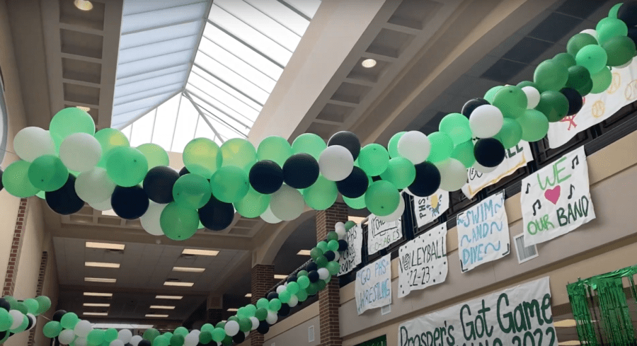 Green, black, and white decorations fill the halls for homecoming week. In the attached video package and article, homecoming candidates describe their campaigning experience and motivation. In order to vote for homecoming king and queen, students can go to prosper.voting4schools.com.