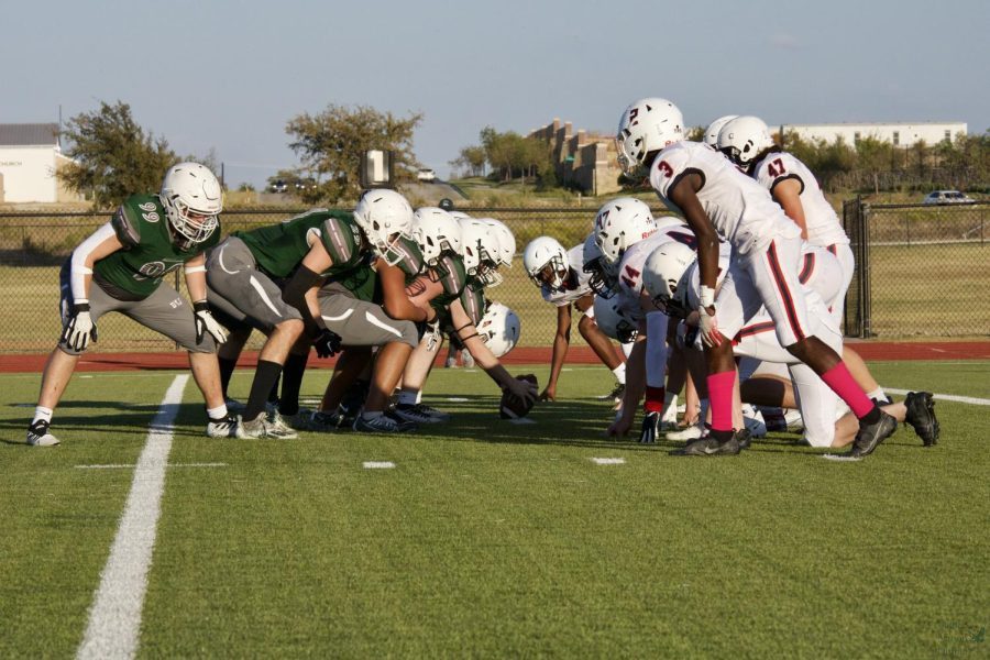 Playing offense, the Prosper High School JV Black team prepares to make their next play against McKinney Boyd. The team has two more games left in the season. The team took home a win  of 62-0.