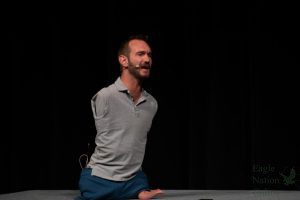 Motivational speaker Nick Vujicic walks across the Rock Hill High School stage as he delivers a speech Wednesday, Oct. 19. Vujicic shared his story in honor of Unity Day. “My whole mission is to let teenagers know that they’re beautiful,” s Vujicic said. “They don’t need to become someone they’re not.”