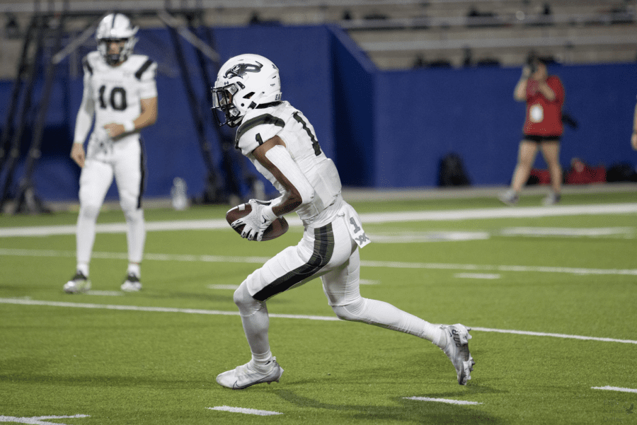 As he runs toward the end zone, senior wide receiver Hunter Summers holds on to the ball after a catching a pass from senior quarterback Harrison Rosar. The Prosper Eagle football team is led by head coach Brandon Schmidt. 
This game was played Thursday, Oct. 13 at the McKinney ISD Stadium. 