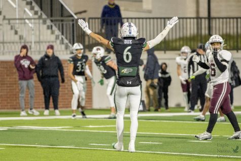 Arms raised, senior Adam Due celebrates a successful pass block. The bi-district game was hosted at Childrens Health Stadium Nov. 18. The Eagles won 28-3 against Plano Senior. The team looks to face off against South Grand Prairie Nov. 18 at Choctaw Stadium.