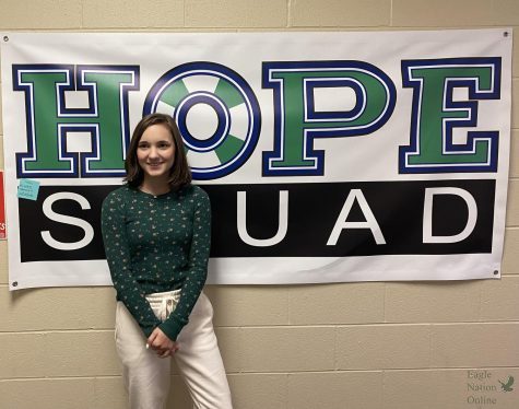 Lauren Clayton, a junior at Prosper High school stands in front of a Hope Squad banner. She advocates for mental health and suicide prevention by raising money and joining in the Prosper Out of Darkness walk. The Prosper Out of the Darkness walk will take place on the morning of Saturday, Nov. 5, in Windsong Ranch. Registration and T-shirt pickup will start at 8:30 in the morning, and the walk kick-off will start at 10 a.m. I will be joining hundreds of thousands of people across the country who are walking in the Out of the Darkness walks to prevent suicide and to support AFSPs mission to save lives and bring hope to those affected by suicide, Clayton said. Its a worthy cause, and one deserving of support from our community.
