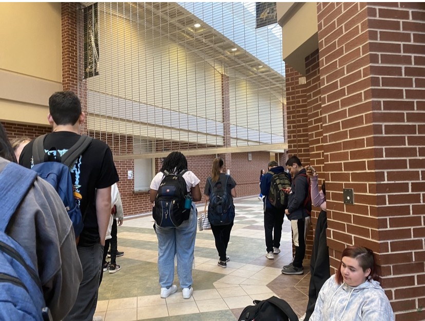 At 8:32 a.m., students wait for the gates to go up at 8:35 a.m. to allow them to get to first period. The gates stay down before 8:35 a.m. to prevent students from roaming the school unless they have tutoring or club meetings. The gate policy is new this year. 