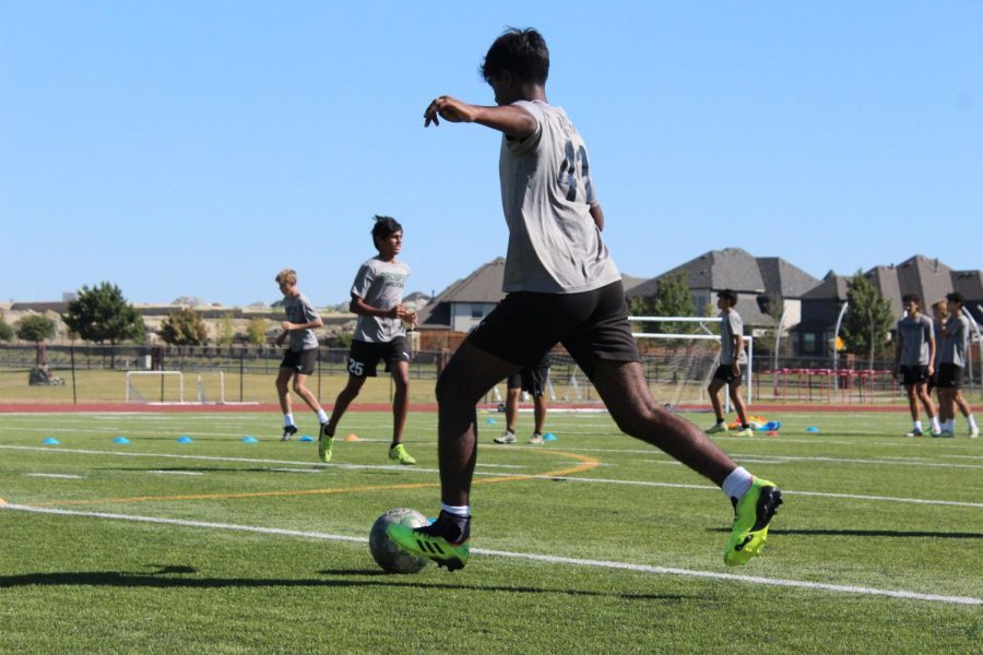 Starting+soccer+warmups%2C+senior+Pranav+Yerram+passes+the+ball+to+the+next+player.+Yerram+has+been+playing+soccer+for+as+long+as+he+can+remember%2C+and+he+continues+to+use+this+sport+as+part+of+his+inspiration+for+medicine.+%E2%80%9CI+believe+what+we+do+as+an+organization+at+school+and+in+the+US+will+give+hope+and+support+to+women+that+have+breast+cancer%2C%E2%80%9D+Yerram+said.+%E2%80%9CI+think+this+will+help+them+push+and+strive+to+survive.+Because+at+the+end+of+the+day+our+lives+%28are+what%29+matter+the+most.%E2%80%9D