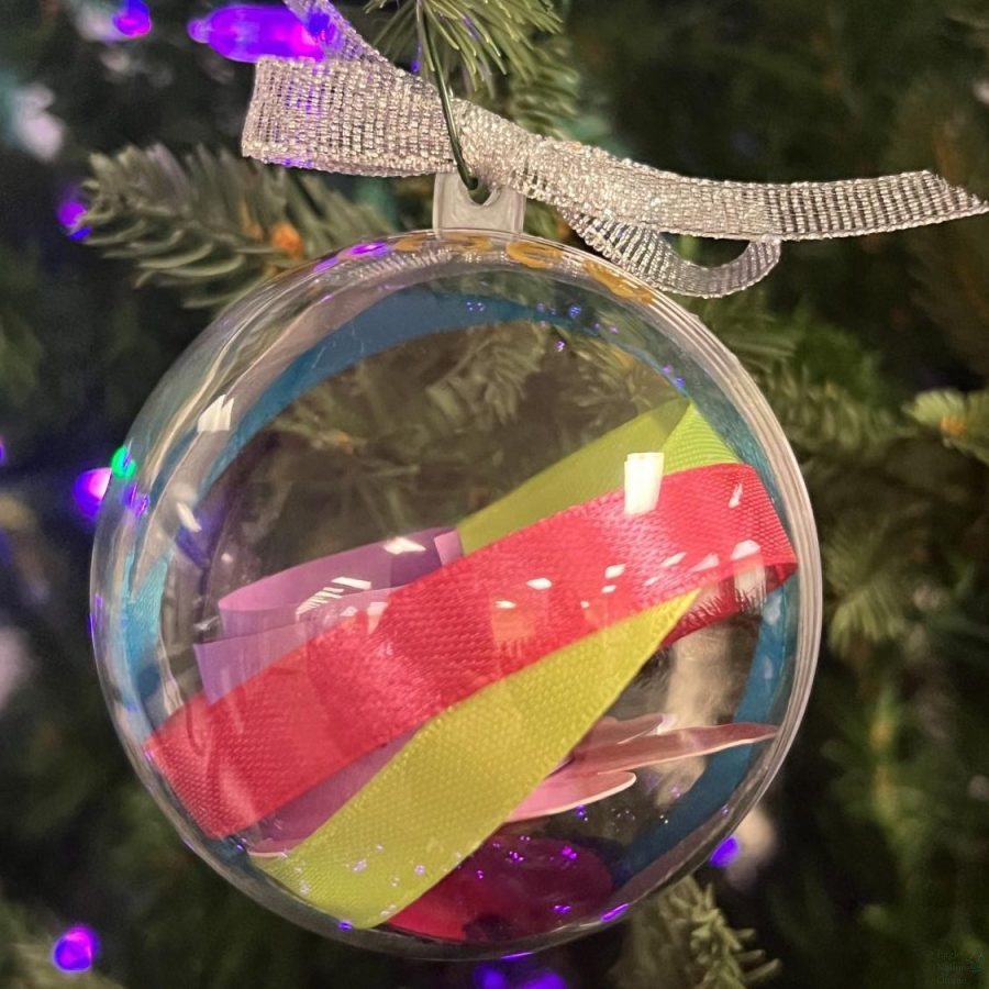 This picture of a Hope Tree ornament, taken by counselor Stephanie Clayton, displays the detail and affection put into every decoration. According to Clayton, this specific symbol of the season reflects the memory of a lost loved one, and joins one of the many made to hang on the Hope Tree. I have tons of different colors of ribbon, Clayton said. Students can select ribbons that represent different emotions that you feel when you think about that person. Some common emotions that people select include love, loneliness, anger, sadness, frustration, hope, encouragement, inspiration and peace.