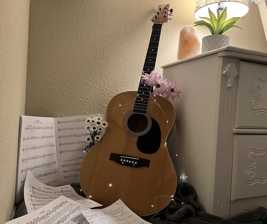 One of sophomore Erica Deutschs favorite instruments to play, the guitar, leans against her nightstand. Through this column, she reflects on the benefits and joy that music can bring. I love getting to play and learn new tunes and techniques on my guitar, Deutsch said. It can be very relaxing, and gives me a sense of peace.