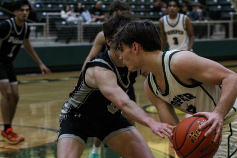 Ball in hand, senior Zander James prepares for a pass. James scored 13 points with five assists on Guyer on Tuesday. The Eagles will play again Friday Jan. 20 at Boyd at 7:15 p.m.