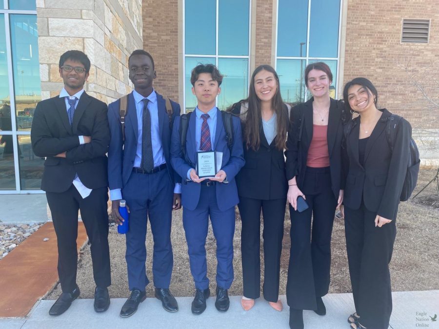 With a National Speech and debate Association District Qualifier plaque in hand, junior James Kim stands with his teammates – freshman Aaditya Ananth, junior Jamie Obala, junior Kaya Miller, sophomore Avery Parker and junior Sasha Zhindon, after the congress district tournament. Kim ranked second in the senate room. NSDA will host the national tournament June 11-16 in Phoenix, Arizona. 