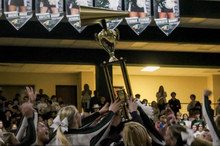 Hoisting up their trophy, are Prospers cheerleaders. The cheerleaders won their NCA High School Nationals competition Jan 21-22. The trophy was presented to them by Superintendent Holly Ferguson.