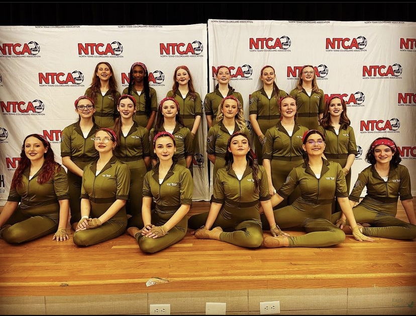 Following+their+final+performance+of+the+season%2C+JV+winter+guard+members+pose+for+a+photo.+The+team+competed+in+the+North+Texas+Color+Guard+Association+%28NTCA%29+circuit+championships+for+the+Scholastic+Regional+A+class+and+received+2nd+place+overall.+Pictured+%28back+to+front%2C+left+to+right%29+are+Klarissa+Warren%2C+Kadrian+Bishop%2C+Macey+Martin%2C+Cora+Oyakawa%2C+Kate+Coombs%2C+Brooklyn+Didonato%2C+Carter+Hollman%2C+Molly+Coombs%2C+Addison+AJ+Didonato%2C+Lyla+Kate+Plasky%2C+Madelyn+Rutledge%2C+Sam+Mitchell%2C+Annika+Spencer%2C+Emma+Tranka%2C+Kamdyn+Setters%2C+Makenzie+Jones%2C+Elizabeth+Giasolli+and+Izzy+Savage.+