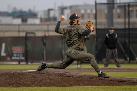 Body extending down the mound, junior Brady Taylor throws a pitch. The first district game will be away on Mar. 15 at 7:30 against Guyer. The team won their last game against Southlake, 5-4.