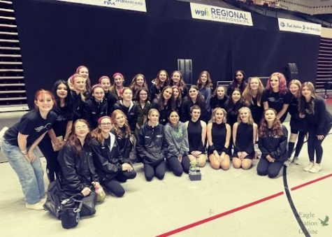 Following the awards ceremony of the Winter Guard International (WGI) Tulsa competition, JV and varsity winter guard members take a group photo with their trophies. Teams performed their shows in the competition on March 4, with both trams advancing to finals. The JV placed 3rd in Scholastic Regional A and varsity placed 10th in Scholastic A. Students in the photo include, Sophia Adams, Nora Vedder, Megan Broyles, Brinley Berkenbile, Kaylee Song, Sammie Munoz, Raegan Meyer, Makenna Boushey, Bella Koakowski, Mya Brim, Kiera Payne, Adison Ewell, Addyson Bergman, Jayden Howeth, Camille Torres, Cora Oyakawa, Klarissa Warren, Annika Spencer, Molly Coombs, Sarah Coombs, Elizabeth Giasolli, Carter Hollman, Addison Didonato, Brooklyn Didonato, Emma Tranka, Sam Mitchell, Lyla Kate Plasky, Makenzie Jones, Macey Martin, Izzy Savage, Kamden Setters and Madelyn Rutledge. 