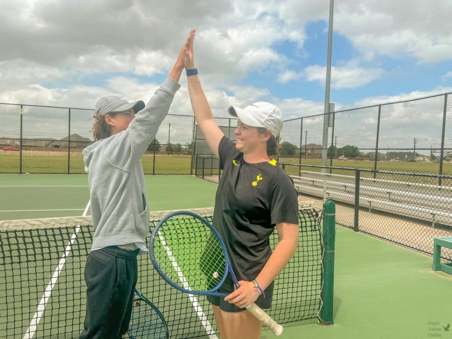 Celebrating, sophomore Nicole Steel and freshman Matteo Mejia prepare for the state championship. Both of them have been on the varsity team since their freshman year. This is the first time a PHS tennis team has gone to state in seven years.