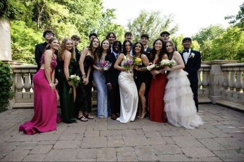 Huddled for a group photo, Kevin Madzima and some of his friends are pictured celebrating their senior prom. Madzima has attended Prosper High School for the past four years and will be going to the University of Oklahoma in the fall. These past few weeks Ive spent so much time reminiscing, Madzima said. But, I cant wait to experience more in the future.
