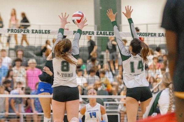 Alongside her teammate, senior Reese Renfrow bounces up to block the ball. The varsity team will partake in a bi-week, resting from their past tournaments, before continuing on. The Lady Eagles took on El Paso Coronado, on Sat. Aug 19, taking home a 2-1 win.