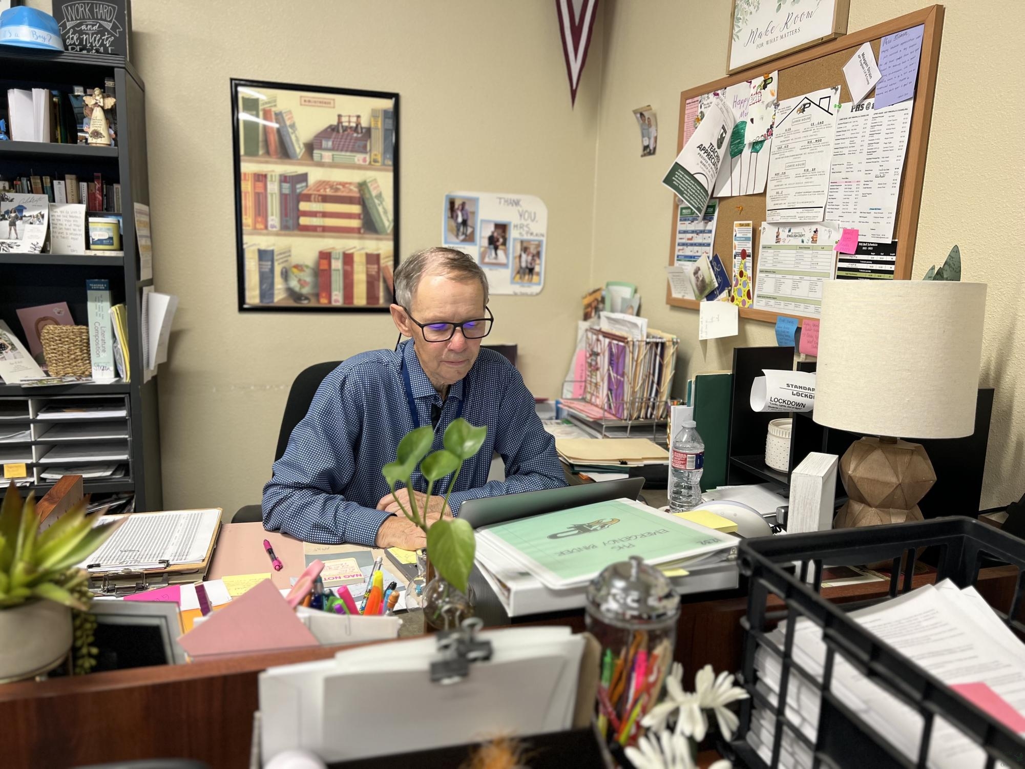 At his desk, long-term substitute Gary Spurgeon works on his computer. PISD hired Spurgeon to substitute for English IV for around three months. In the attached article, Spurgeon shares his story overcoming cancer and returning to his job as a teacher. 