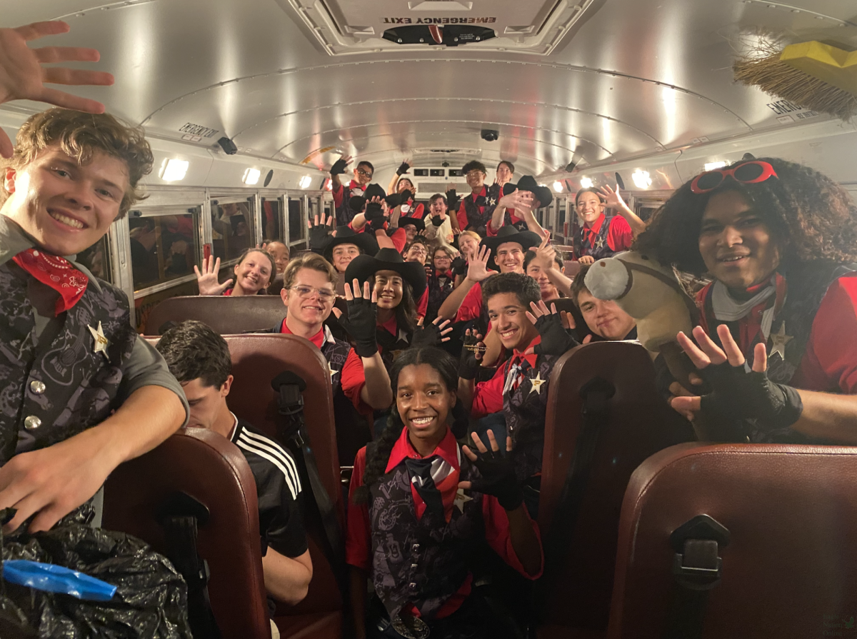 Holding up a five, the trumpet section of the band celebrates getting fifth place at UIL Area C. The top six competing bands advance to state. PHS Band has not qualified for the UIL State competition since 2018. 