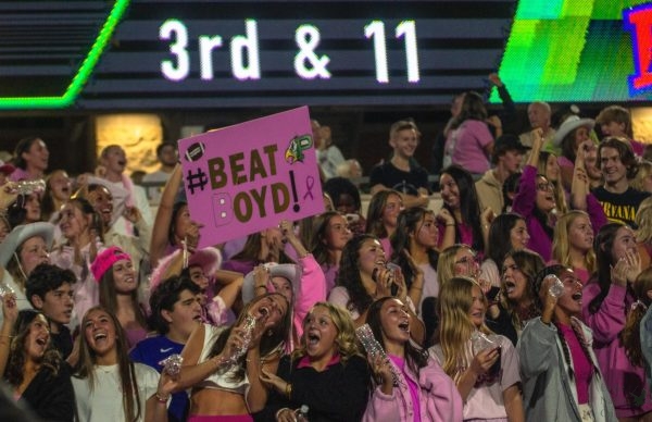 The home side student section screams as the team scores a touchdown, leaving the score at 12-0. It was a 60-yard interception return for a touchdown. The theme this week was Pink Out for Breast Cancer Awareness month.