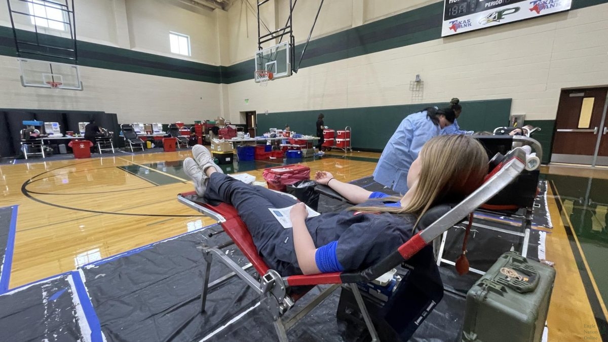 In+the+PHS+gym%2C+senior+Courtney+Reed+gets+ready+to+donate+blood.+Carter+Blood+Care+works+with+the+HOSA+organization+to+host+a+blood+drive+for+students+today%2C+Nov.+27.+Seniors+can+get+an+honor+cord+for+graduation+if+they+donate+twice+%E2%80%93+once+in+the+first+semester+and+once+in+the+second+semester.+There+will+be+another+opportunity+for+16-year-olds+%28with+a+parent-signed+form%29+and+17-year-olds+%28and+older%29+to+donate+in+the+spring.+Every+blood+drive+we+do+saves+so+many+lives%2C+HOSA+sponsor+and+health+sciences+teacher+Kelli+Factor+said.+As+you+know%2C+there+is+a+massive+shortage+of+blood+available%2C+so+this+really+does+make+a+difference+for+our+community.+Every+pint+collected+can+save+up+to+three+lives.++