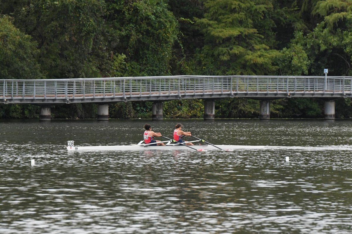 During a doubles race, senior Kaya Miller nears the midpoint of her rowing race. During this regatta, she placed 3rd in her quad race and 2nd in her doubles race. It was during fall season which have distance races from 4K-6K meters. 