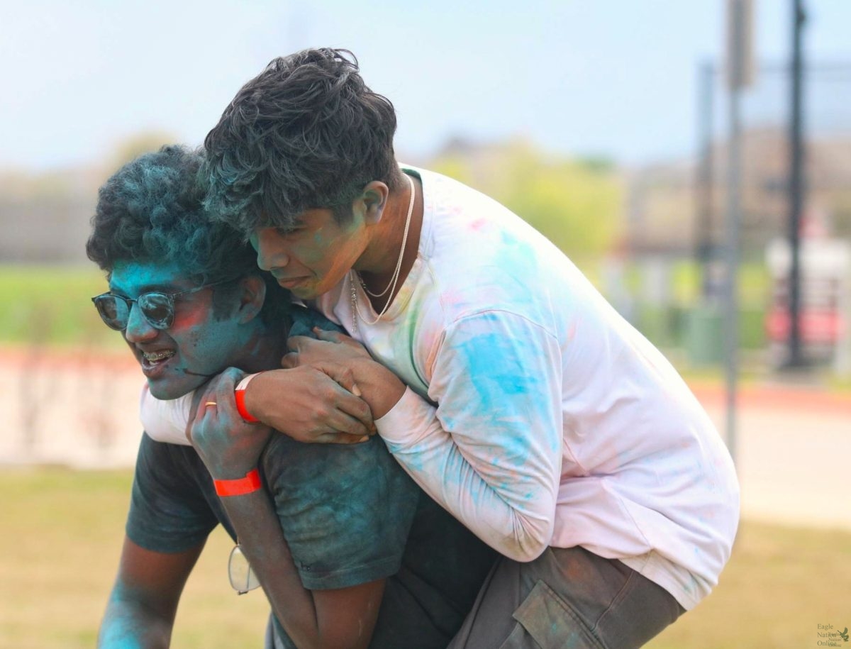 As he jumps onto junior 
Jai Akash Gopikrishnan Kumudavallis back, junior Ajay Adithyan spends time with his friends at the Indian Student Association Holi celebration. The best part of this is meeting the community and just having fun, Adithyan said. We get to meet up with friends and enjoy cultural activities together.