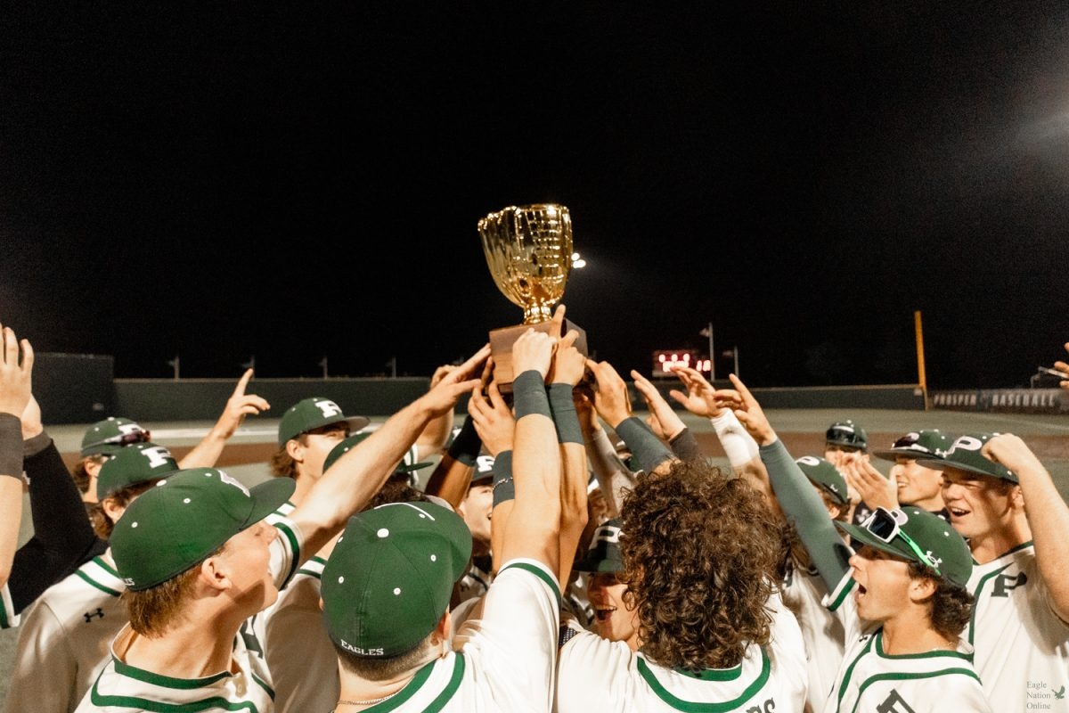 Hands in the air, the Prosper High School baseball team celebrates their win as district champions. The team won 2-0 against the McKinney lions. The team will play against Coppell High School on May 2. 