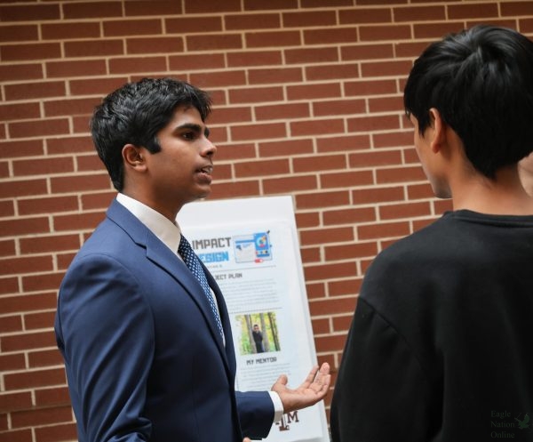 Hand toward viewers, junior Ajay Baskaran discusses his experience in the program. PCIS has been great learning opportunity to explore multiple career options, so I can decide for my future, Baskaran said. It has allowed me to network and gain contacts that might be important for my education.
